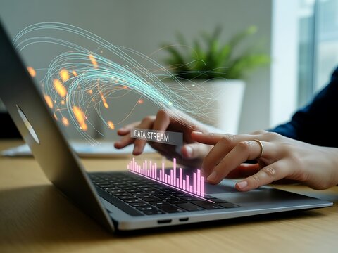 Person using laptop with glowing data stream and bar graph visualization technology