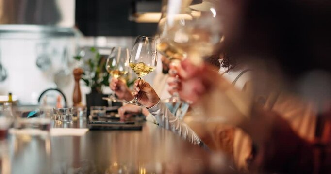 Group, hands and swirl wine for tasting experience, release aroma or improve flavor at pub. Friends, glass and test alcohol for quality drink, beverage or people at bar for happy hour at social event