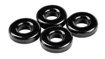 Black glossy chewy candy rings with smooth surface and shiny texture