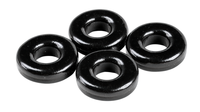 Black glossy chewy candy rings with smooth surface and shiny texture