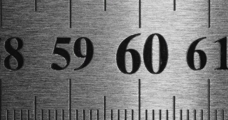 Metal Ruler Close-Up. Video featuring a detailed view of a sleek metal ruler with precise millimeter markings, captured in high clarity.