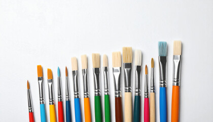 Fototapeta premium Artistic Symphony of Brushes: A colorful ensemble of artist's brushes, each poised for its next stroke, creating a visual symphony of artistic potential.