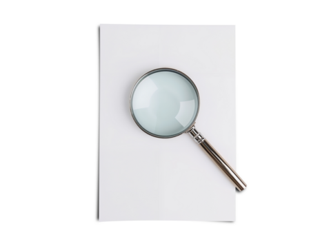 Magnifying glass on white paper sheet, search tool concept, object focus, clean background