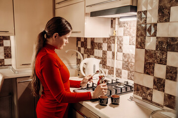 Woman Kitchen Coffee Preparation: Home cooking coffee beans indoor evening routine.
