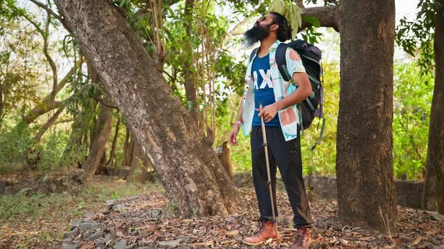 Smiling Vacationer Finds Peace Beneath Forest Trees