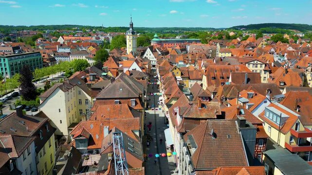 4K Aerial Drone Video of the Historic Herrieder Clock Tower in the Old Town area of Downtown Ansbach, Germany