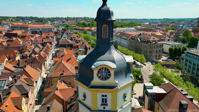 4K Aerial Drone Video of the Historic Herrieder Clock Tower in the Old Town area of Downtown Ansbach, Germany
