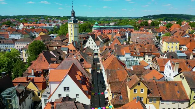 4K Aerial Drone Video of the Historic Herrieder Clock Tower in the Old Town area of Downtown Ansbach, Germany