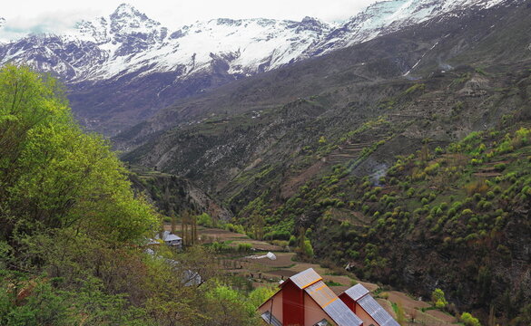 birds eye view of beautiful kyelang or keylong hillstation, surrounded by snowcapped himalaya mountains in lahaul valley, himachal pradesh in india