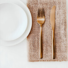 Elegant Table Setting: Rose Gold Flatware on Burlap