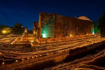 Asarnha Bucha Day at Wat Mahayong Temple Ayutthaya, Thailand is an activity where Buddhists to make merit, pray, and meditate for happiness and good fortune in life.