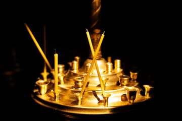 church candles on a dark background