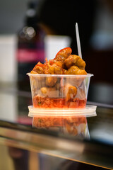 Take away stir fry food served into a container 