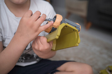 Child with autism playing with cars. Autism concept