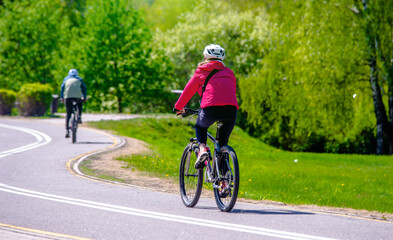 Cyclist ride on the bike path in the city Park