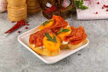 Bruschetta with sausage and tomato