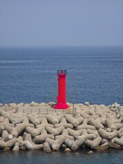 Blue sky and blue sea meet horizon, and red lighthouse background of the port - 푸른 하늘과 푸른 바다가 맞닿은 수평선, 그리고 항구의 빨간 등대 배경, 영덕, 한국
