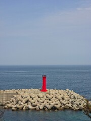 Blue sky and blue sea meet horizon, and red lighthouse background of the port - 푸른 하늘과...