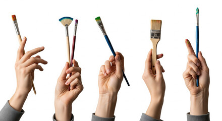 Diverse brushes held by hands on display: A creative assortment of paintbrushes held by hands, displayed against a background, perfect for illustrating artistic expression and craft projects.