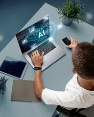 Young professional engages with AI technology on laptop while using smartphone in modern office...
