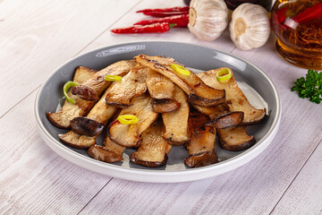 Roasted eringi mushrooms in the plate