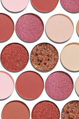 Cosmetics texture pattern, Warm vivid colored eye shadow makeup palette, round eye powder swatches. Female cosmetic and beauty products, aesthetic minimal beauty photo, colorful eyeshade, top view