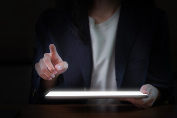 Close-Up Image of a Businesswoman's Hand Using a Digital Tablet.