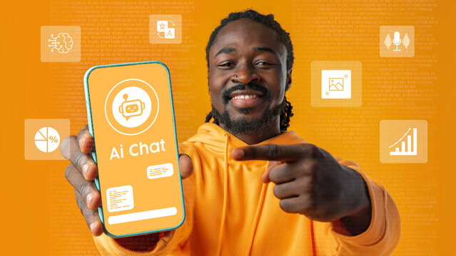 Young man showcasing AI chat application on smartphone with vibrant orange background in a tech-focused environment