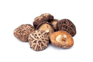 Dried shiitake mushrooms pile isolated on white background.