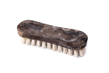 old scrub floor brush made from wood that has been heavily used is worn out and are stains with...