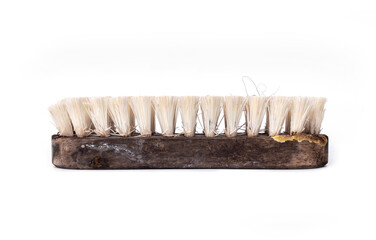 old scrub floor brush made from wood that has been heavily used is worn out and are stains with...
