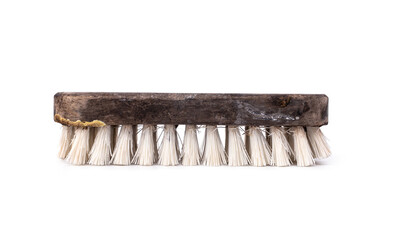 old scrub floor brush made from wood that has been heavily used is worn out and are stains with...
