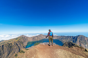 Hiker and traveller hiking at Mount Rinjani, Lombok, the second highest volcano in Indonesia.