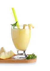 Wooden board with glass of tasty melon smoothie and mint on white background