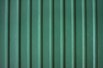 Close-up texture background photo of green striped galvanized steel pattern.