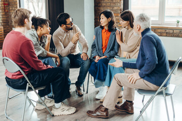 Diverse group of people supporting each other during therapy session