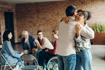Patients hugging after successful psychotherapy session