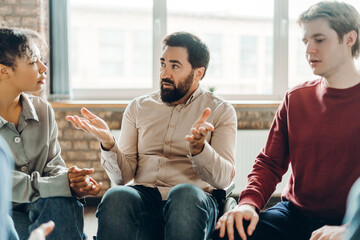 Psychologist leading support group therapy for people with disabilities