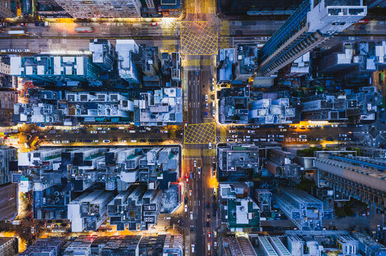 Aerial top down view of intersection with traffic at night, Hong Kong
