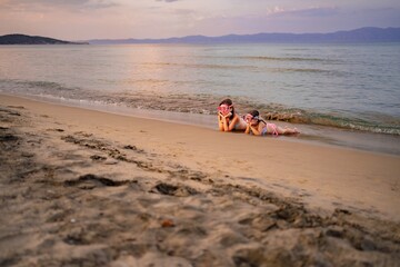 Fun moments at the beach with family enjoying the sunset together