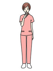 女性看護師の正面立ちポーズ　スクラブ　静かにする合図