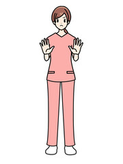女性看護師の正面立ちポーズ　スクラブ　拒否するポーズ