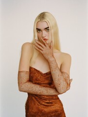 aesthetic editorial content - mysterious blonde strong brow sheer gloves strapless dress, fashion it girl hands covering her mouth silent beauty