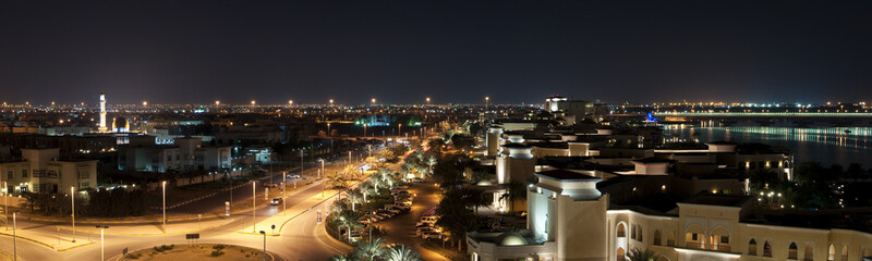 High angle view of illuminated buildings in Abu Dhabi at night