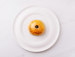 Delicious pastry placed on a white plate in a bright kitchen setting