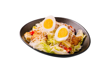Delicious salad featuring fresh vegetables and boiled eggs served in a bowl