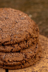 sweet chocolate-flavored biscuits with sesame seeds on the table, closeup