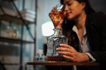 Closeup business woman holding a glass of whiskey