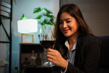Closeup business woman holding a glass of wine