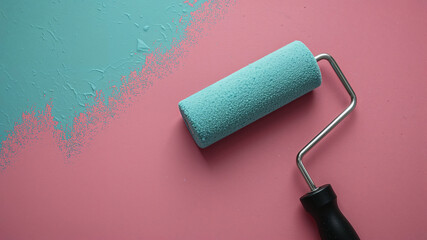 Obraz premium Paint roller painting pink surface with turquoise paint
